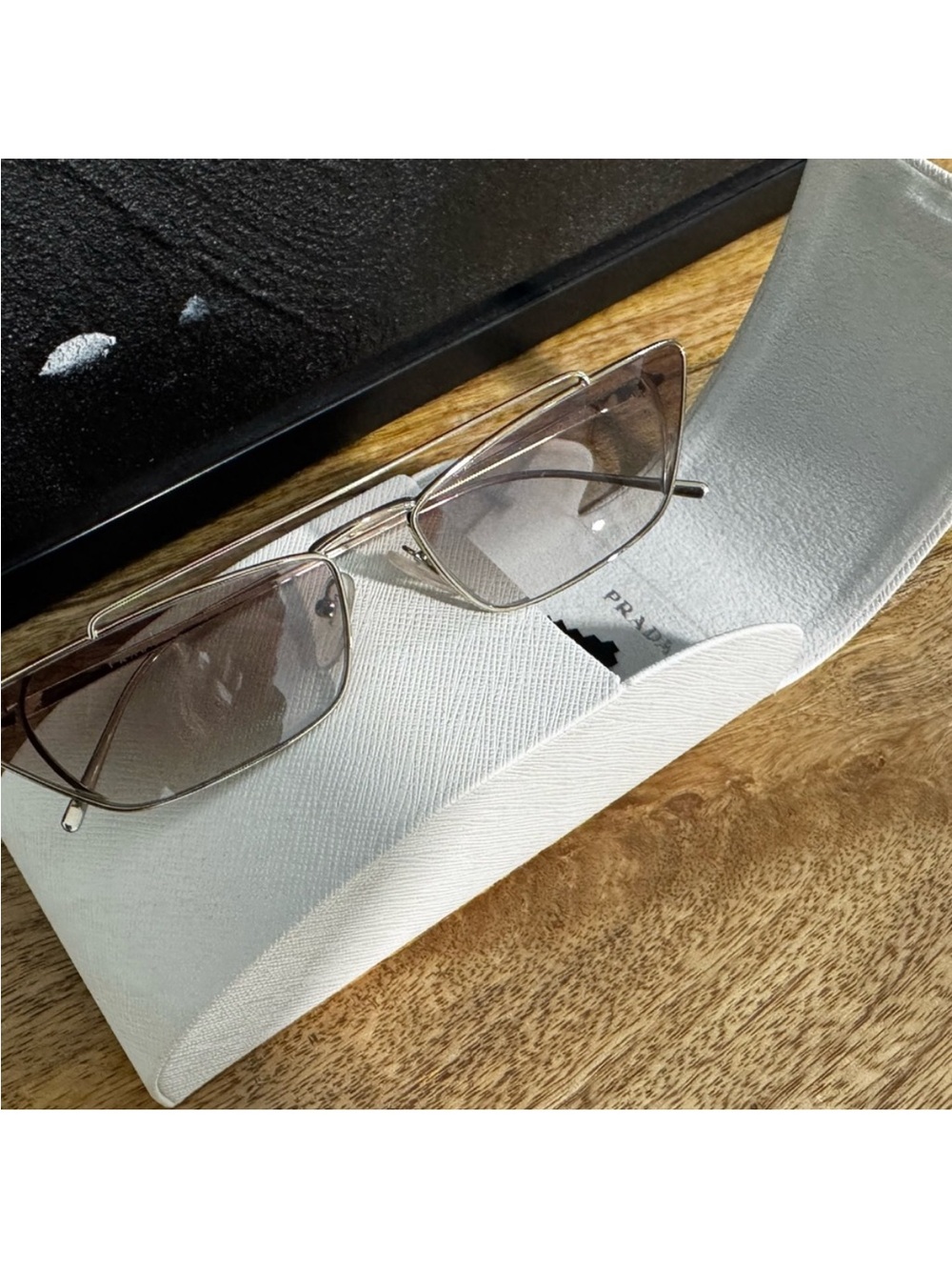 Prada Silver Frame Sunglasses with Gray Lenses